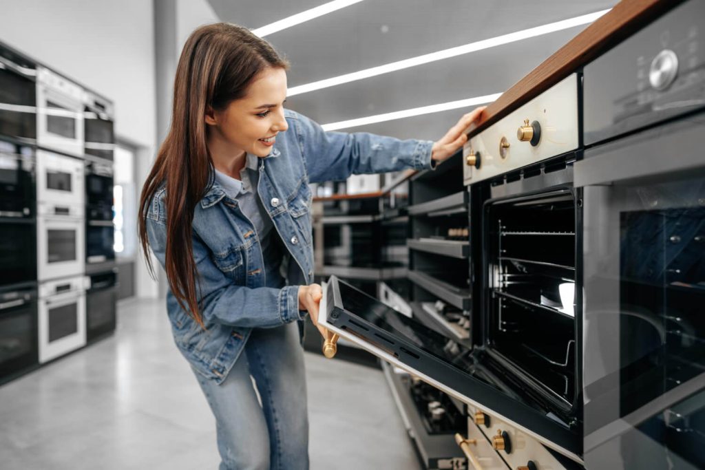 girl-opening-cooker-oven-door